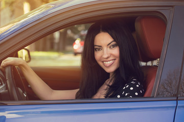 Young woman driving a car