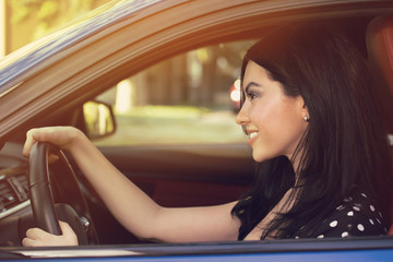 Young woman driving a car