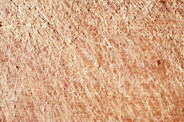 The texture of the surface of the wood with scratches.
