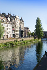 Obraz premium STRASBOURG, FRANCE - August 23, 2016 : Street view of Traditional houses in Strasbourg, Alsace. is the official seat of the European Parliament, Located close to the border with Germany
