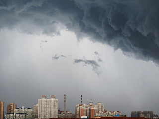 Dramatic cumulonimbus stormy clouds over city of Shanghai, China.