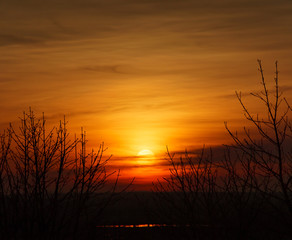 Naklejka premium Dramatic landscape sunset. Bright colorful sky and clouds