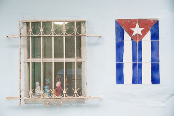 cuban flag on the wall near a window