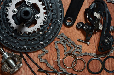 Many different metal parts and components of the running gear of a sports bike