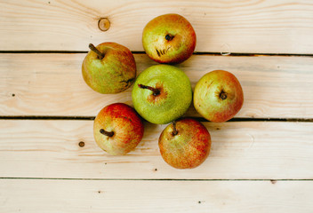 Pears on wood background