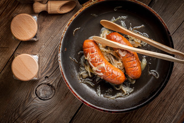 Fried sausage with onions.