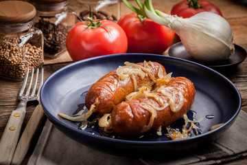 Fried sausage with onions.