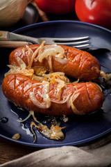 Fried sausage with onions.