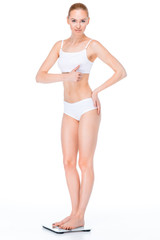 Fototapeta premium Woman on digital scales