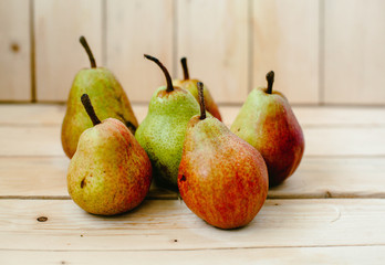 Pears on wood background