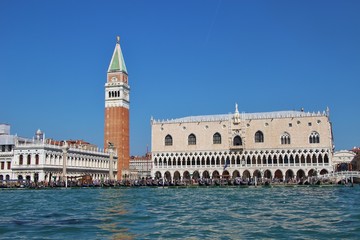 Fototapeta na wymiar Panoramic view of Saint Mark's square in Venice: The bell tower or Campanile of the Basilica Saint Mark and the Doge's palace. Italy, Europe.