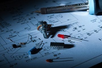 Close-up of electronic components on scheme at night