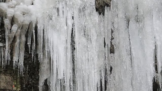 Beautiful frozen waterfall in Kamianets-Podilskyi city in western Ukraine