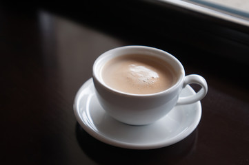 White cup with cappuccino