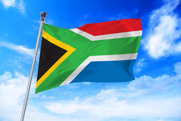 Flag of South Africa developing against a clear blue sky