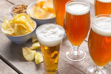 glass beer on wood background