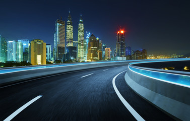 Highway overpass modern city skyline background .Night scene .