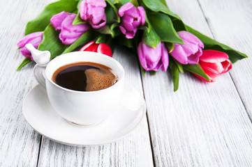 cup of coffee with tulips