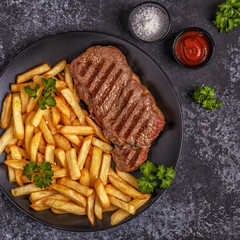 Beef barbecue steak with french fries.