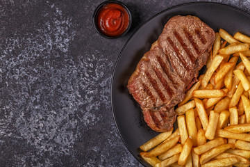 Beef barbecue steak with french fries.