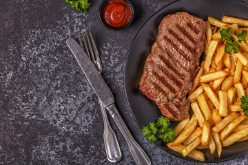 Beef barbecue steak with french fries.