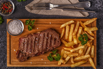 Beef barbecue steak with french fries.