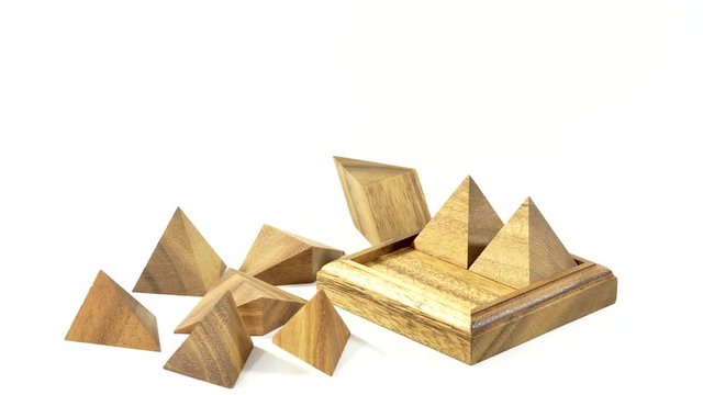 Puzzle assembly of a pyramid from individual wooden elements
