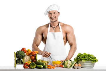 Man bodybuilder in white toque blanche and cook protective apron