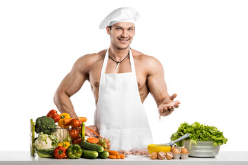 Man bodybuilder in white toque blanche and cook protective apron