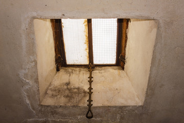 close-up of an old  skylight of an attic /the windows of an old skylight illuminated by the sun