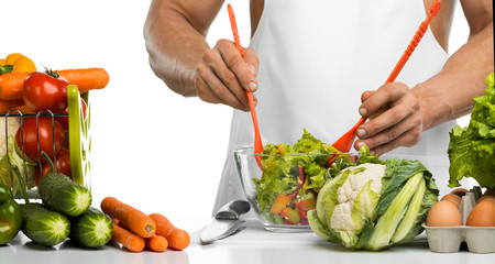 man hand cook make mix vegetables salad on kitchen