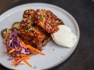 Sweet sauce chicken with egg on waffle