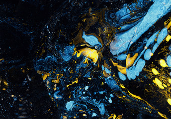 Fototapeta na wymiar Abstract hand-made texture. Marbling blue and yellow background for design