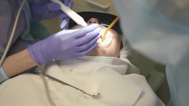 Doctor, dentist, jet, ultrasound, cleaning, tartar, jaw, gloves, sterile, hygiene, health. 4k. 3840x2160