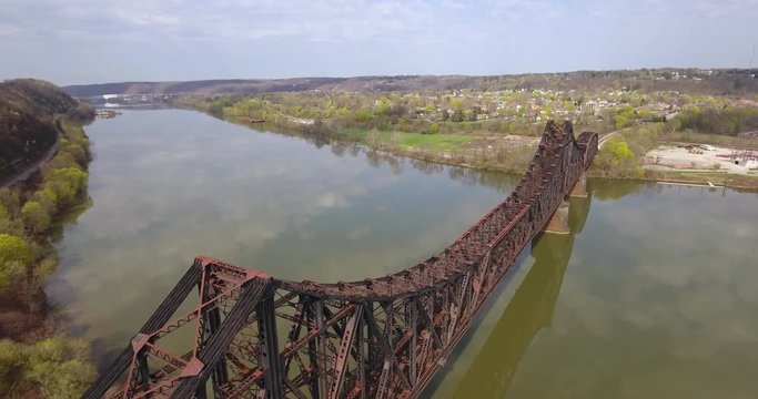 MONACA, PA - Circa April, 2017 - A daytime aerial view of a railroad bridge on the Ohio River in Western Pennsylvania.  	