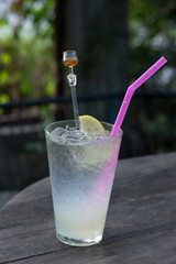Iced Lemon juice glass on wood table.