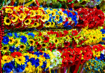 Fototapeta na wymiar Wreath with flowers. Ukrainian wreath. Ukrainian wreath with ribbons