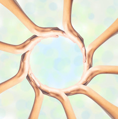 Human hands making circle on bright background