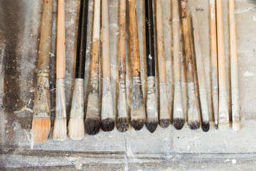 Paintbrushes lying in artist's studio