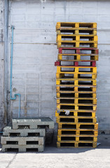 Old wooden and plastic pallets,industrial object.