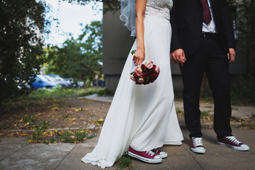Bride and groom holding hands