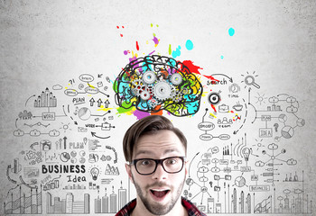 Excited man in glasses, brain and gears
