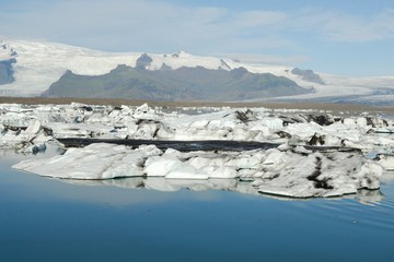 Fototapeta na wymiar Icebergs floating in Jokulsarlon glacier lake, Iceland