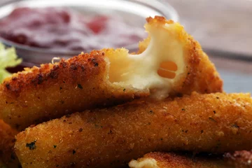 Fototapeten Breaded mozzarella cheese sticks with tomato ketchup and bbq sauce © beats_