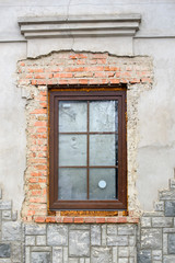 new window in an old building with red brick
