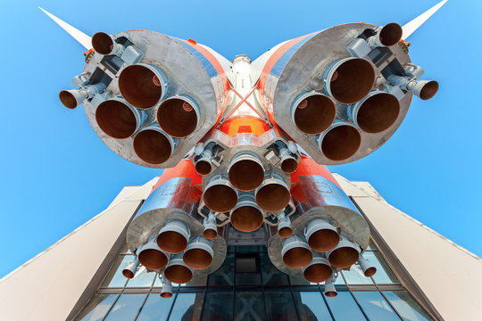 Russian space transport rocket with rocket engines against the blue sky