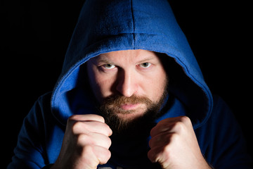 Portrait of a fighter in a hood