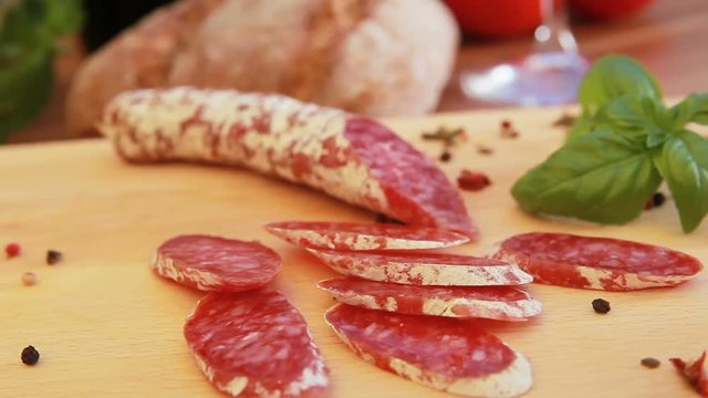 Cured homemade salami on a wooden board