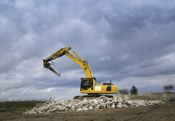 Excavator on the ruins of a building in Arnsdorf