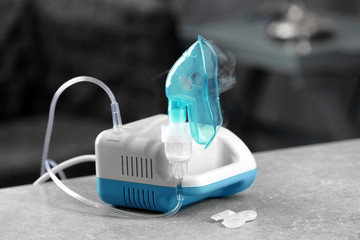 Compressor nebulizer with mask on table